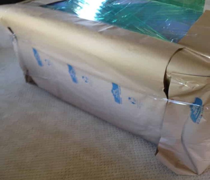 Couch being prepared for wrapping