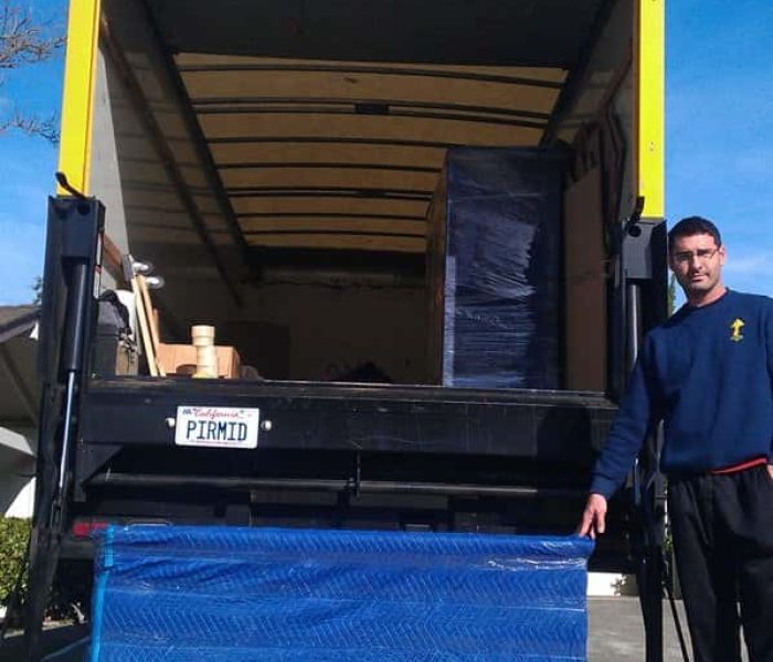 Rusty (owner) loading a dresser onto the Truck.
