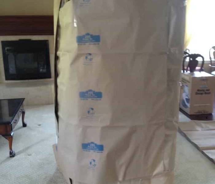 Couch being prepared for wrapping.