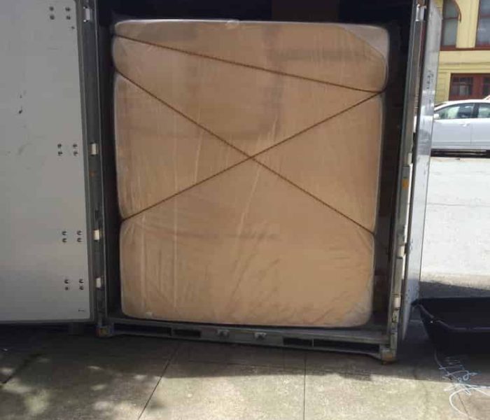 Pyramid loading and stacking a Container for cross country moving.