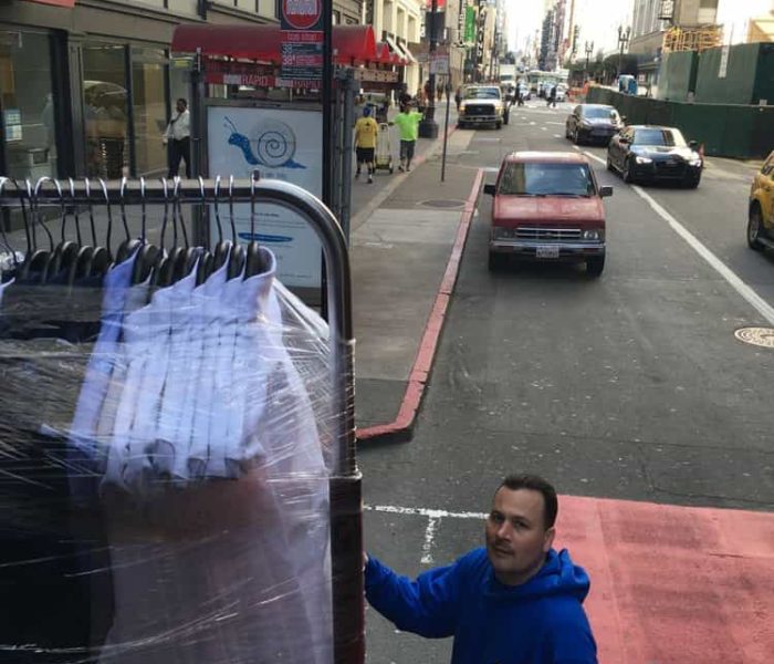 Moving Barney's N.Y clothing down the str. in S.F , CA