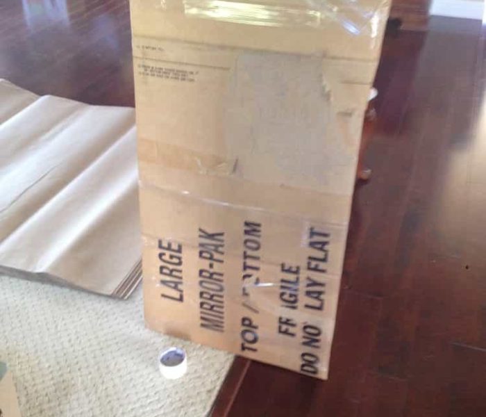 Glass being crated with a carton for extra protection.